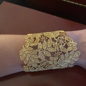 Gold women’s cuff bracelet w/ earrings